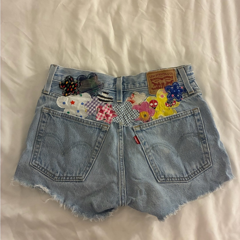 Levi's Light Blue Denim Shorts with Multicolor Patch Accents